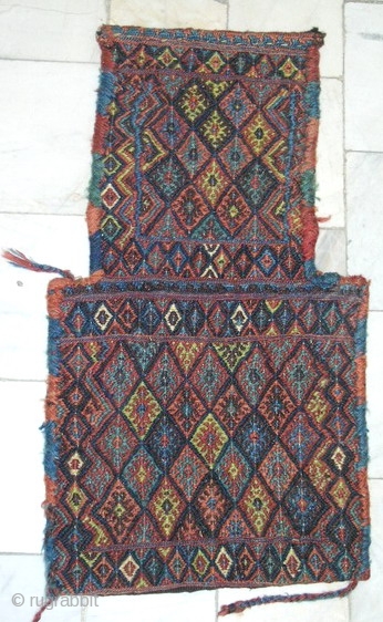 North West Of Persia
Kurd Tribal Sannjabi area,all wool needle work( Ladi style)salt bag
circa 1940,in mint condition size 0.68cm x 0.38cm.
all natural colors           