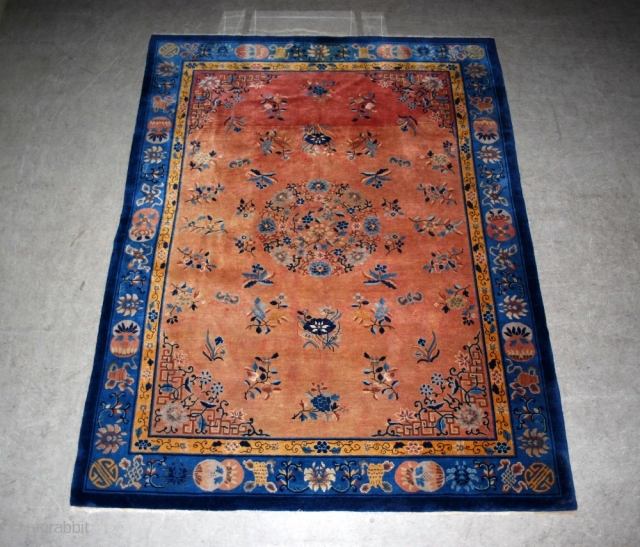 Antique Chinese carpet. Profusely decorated with bats, butterflies and urns. Unusual colour. Lovely condition. 330 x 250 cm.               