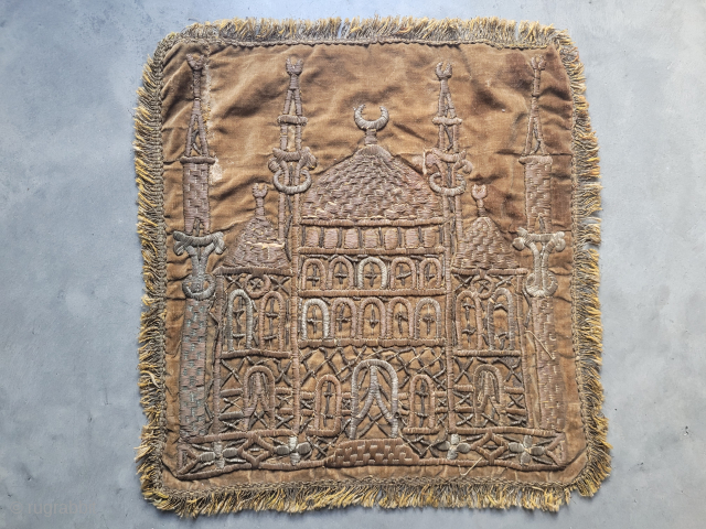 Small two-toned metal wire embroidered wall hanging of a mosque with four minarets on brown velvet. Probably Bursa, late 19th century. Some loose bits and small tears with one old repair hidden  ...