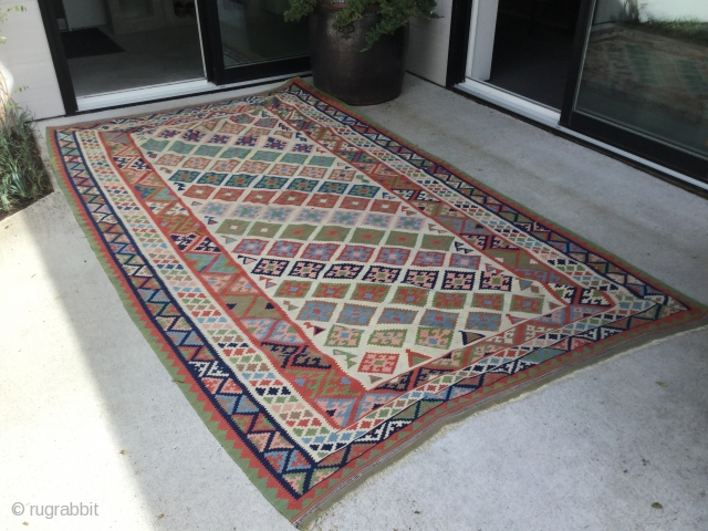 Quashqai kilim, probably mid 20th century. Decorative pastel palette with white ground. Minor stains as shown. Ready for use. 110 x 65 inches (280 x 165 cm).      