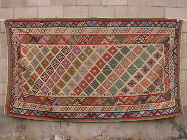 Qashqai kilim in good condition, ready for use. Decorative white ground with pastel colours. a few small stains, as shown in the last photo. 110" x 65" (280 cm x 165 cm).  ...