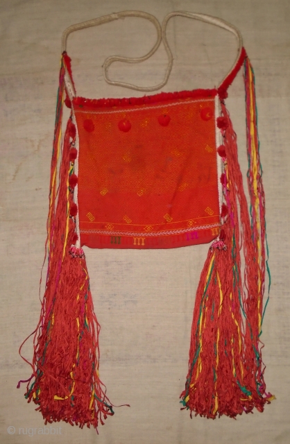 Kachin "n'hpye" shoulder bag,North Burma,cotton and small amount of metallic thread.
the beads where the dangles attach to bag are plastic so probably 1960-1980, some small dirty spots,not that noticeable..29x29(body of bag)..good strong  ...