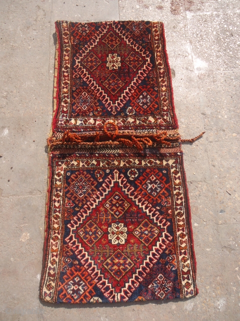 Very fine complete Qashqai Khorjin with great shiny wool and all good colors,good age and excellent conditio.Original kilim backing and tassels.Size 3'7"*1'7".E.mail for more info and pics.

      