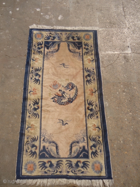 Chinese or Tibet Rug with Dragon in the middle and many dancing Flamingo in the border,nice wool,good colors and condition.Size 4'5"*2'4".E.mail for more info and pics.       