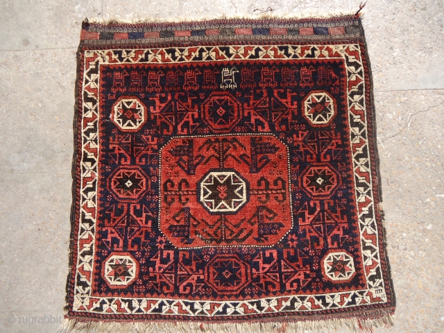 Very rare and beautiful Baluch Bagface with runing dogs and goats, all good colors,without any repair done.good age,Fine weave and unusual design.Size 2'4'*2'4".E.mail for more info.       