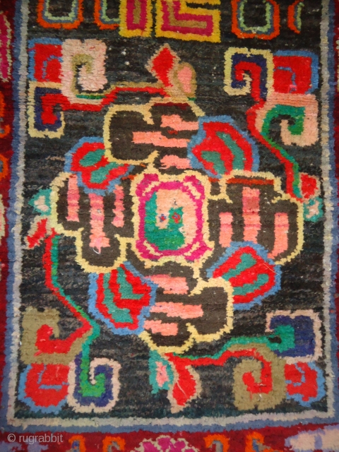 Tibet Rug with some synthetic colours but authentic design, Fine condition,Size 5*2'6".Handwashed ready for use.                  