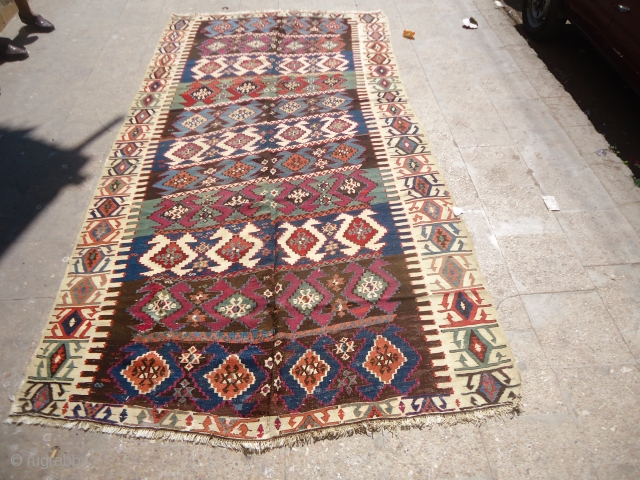 Anatolian Kilim with good age and great natural colors,fine weave,some old repair done,All beautiful colors and a very nice design.Size 10'7"*5'6".E.mail for more info and pics.       