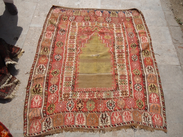 Dated Anatolian Prayer Kilim with good colors and age,fine weave.beautiful design and pattern.Size 5'3"*4'7".Dated in the middle. E.mail for more info and pics.
          