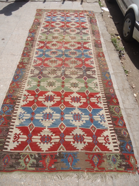 An early Anatolian Kilim  with great colors and metal thread used,fine weave and good design with beautiful border.Size 12'4"*4'10".E.mail for more info.          