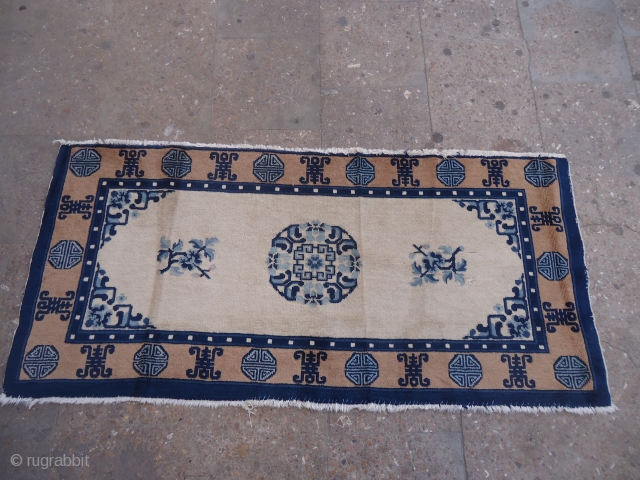 Chinese Ivory Ground Rug with good colors,condition and age,Size 4'8"*2'2".E.mail for more info and pics.                  