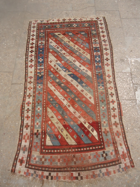 Early Caucasian Rug with great natural colors and beautiful design.As found without any repair or work done.Size 5'10"*3'1".E.mail for more info and pics.          