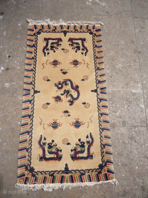 Chinese or Chinese Rug with five dragons,beautiful colors and unusual Ivory field,excellent condition,without any repair or work done.All nice colors,fine weave,Size 4'6"*2'3".E.mail for more info and pics.      