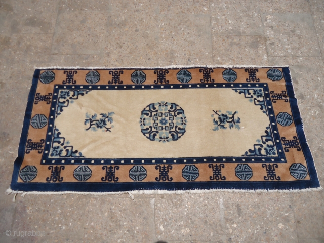 Ivory ground chinese seating rug with nice design and good condition.Size 4'7"*2'1".E.mail for more info and pics.                