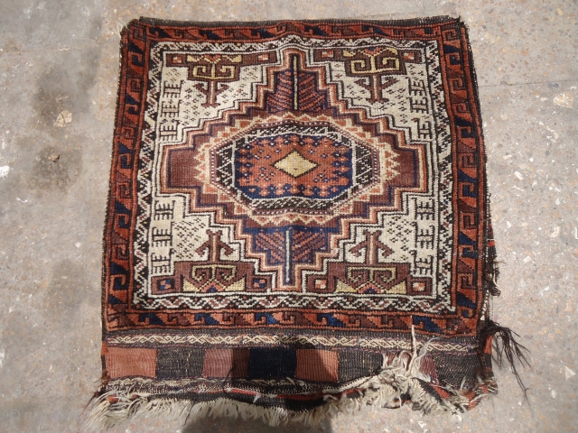 Ivory ground baluch bagface with goats or dogs,original kilim backing,nice bag with good colors and design.Size 2*2.E.mail for more info and pics.           