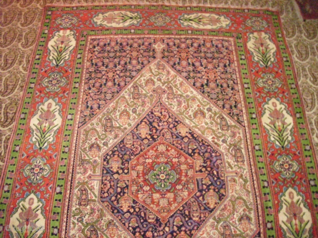 Senneh Rug,wool on silk base,beautiful colours,excellent condition and desigen,without any repair,Thin and soft like cloth.Metal rings for hanging on back.Size 6'9"*4'4".            