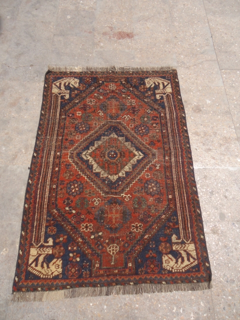 Qashqai or Shiraz Rug with four Lions each or every corner,all original without any repair or work done.Beautiful rug but worn.All natural colors.Size 4'5"*3'1".E.mail for more info and pics.    