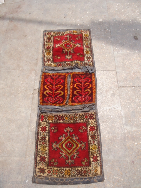 Piled Anatolian Khorjian with original Kilim backing and leather,all original without any repair or work done,nice design.Size 3'10"*1'5".E.mail for more info and pics.          