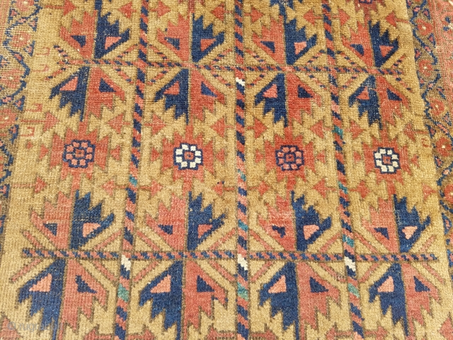 Camel ground Baluch rug with good colors and design,as found without any repair or work done. Size 5'2*2'11".E.mail for more info and pics.          