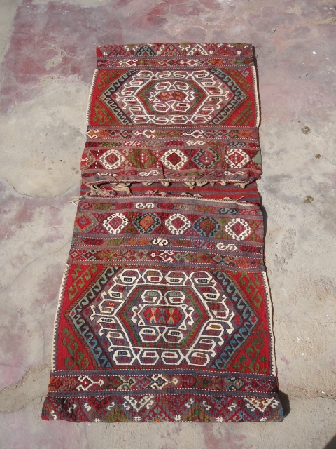 Eastern Anatolian heybe (double bag)from the Malatya region with metal threads,beautiful colours and very fine weave,all good colours,good age,very good condition,Size 4'10"*2'2".E.mail for more info.        