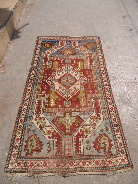 Kasim Ushaq Rug with nice colors and design,good age,as found without any repair or work done.Size 8*4'2".E.mail for more info and pics.           