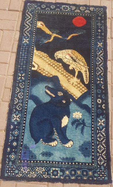 Tibet or Chinese Rug with aoft shiney wool,very beautiful and bold pictureal rug,good age,colors and design.Clean and ready for show.Size 4'8*2'4".E.mail for more info and pics.       