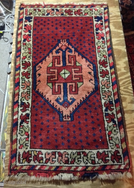 For sale Turkish yastik, 1'7" x 2'10", early 20th Century, wool warp and weft, good pile. Small hole, 1"x1" in border, both end fraying,         