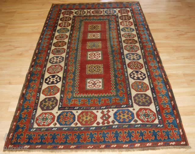 Antique Caucasian Kazak rug with compartment design, probably Bordjalou area. www.knightsantiques.co.uk 

Circa 1890.

Size: 7ft 4in x 4ft 3in (223 x 130cm).

An interesting Kazak rug with a number of different design elements. The  ...