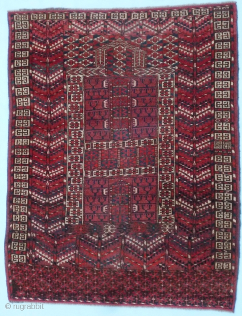 (37) Cherry-red Tekke Ensi (mihrab), 138 x 112, with a very cheery disposition. Plenty of turquoise and white as complimentary highlights, a close pile with very slight wear. Skirt is full of  ...