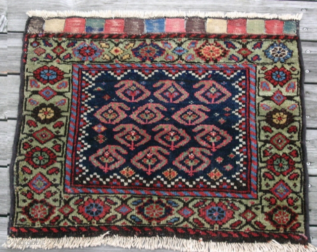{89} 68 x 59 cm. Rare, green-border Afshar bag face. Full pile, cotton warp, double-wefted, good colors, selvage added. For sale at cost.
-Kolya          