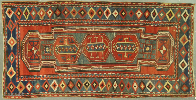 Caucasian Kazak, late 1800s. 4½ x 9 ft (140 x 270 cm), good condition. Double shield design. Reduced from $4,950.             