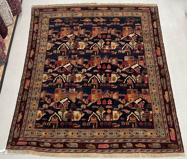 10½ x 13 ft (315 x 390 cm) Afghan war rug from the 1980s. Collector's item, with Kamov helicopters, limousines (Zil?), tanks (T-72?), airplanes (Su-24?), apartment blocks, and civilian and military vehicles.  ...