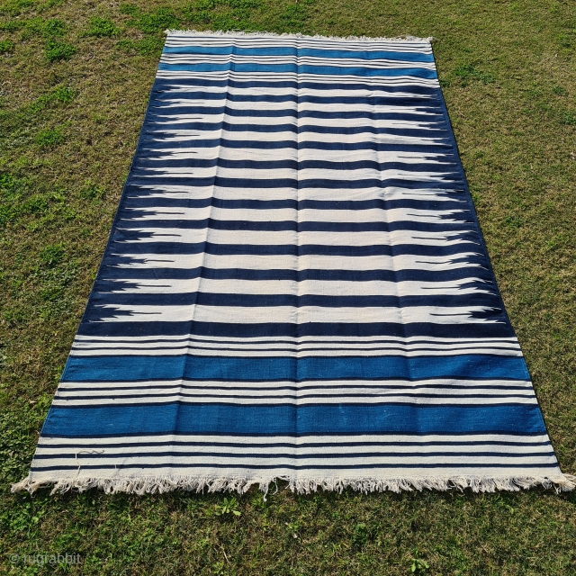 Jail Dhurrie, Indigo Blue-White striped, Hand Spun Cotton, From Bikaner ,Rajasthan ,
India. India.
This Kind of Jail Dhurrie’s were made in Indian prisons during British rule to India.
C.1920-1940.
Its size is 145cmX248cm (20220129_143843).
  