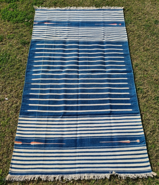 Jail Dhurrie, Indigo Blue-White striped, Hand Spun Cotton, From Bikaner Rajasthan , India. India.

These Kinds of Jail Dhurrie’s were made in Indian prisons during British rule in India.

C.1920-1940.

Its size is 112cmX195cm(20220129_144041)  
