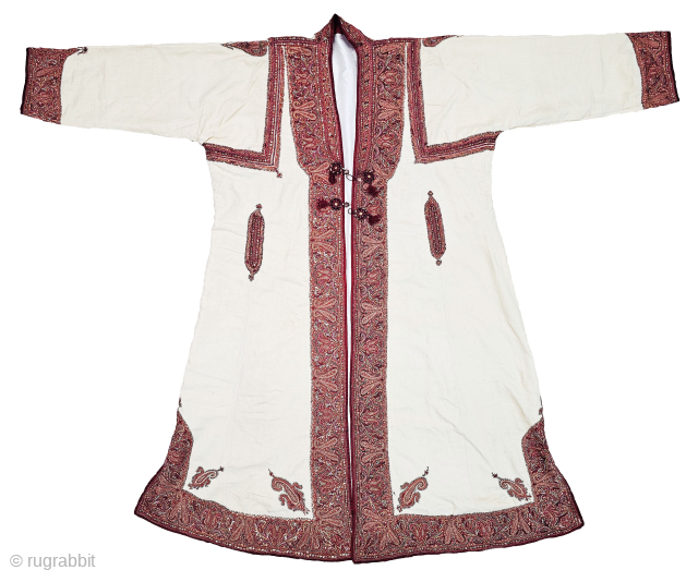 An Kashmir (Red-Marron Color) Embroidery Choga (Coat) Borders with Keri butis, From Kashmir, India. India.

There are imitation pockets in the front and similar motifs on the sleeves, The back and Shoulders are  ...