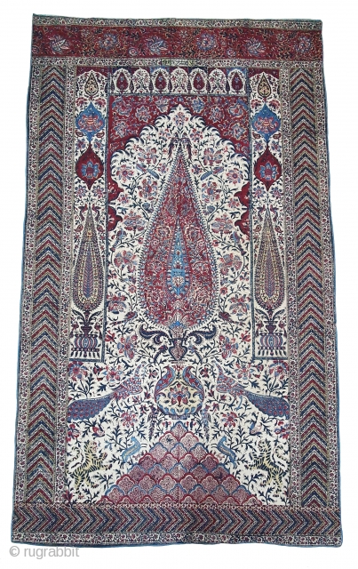 Kalamkari Palampore from South India. India. Made for Export Market, Printed cotton with exotic birds, peacocks, tigers, stylized mountain and cypress trees all within mihrab. Surrounded by lozenge border Cotton backing. Late  ...