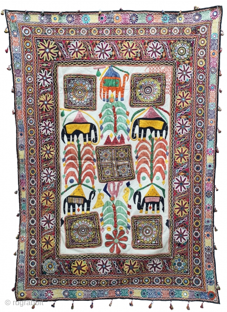 One of the best and rarest example of Dharaniya  Applique Wall Hanging . 
Appliqued with silk and cotton on cotton base with embroidery and decorated with pom-poms with  mirror work,
Made and used by  ...