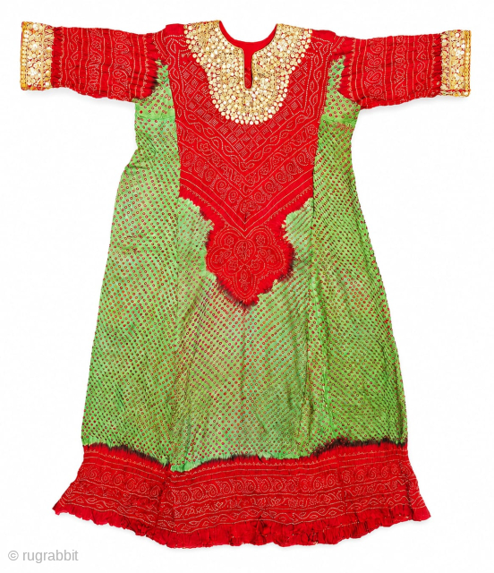 Aabha – Wedding Dress (Long Tunic).
A rare and elegant Aabha (Wedding Dress), crafted from fine silk with a beautiful Bandhani (tie-dyed resist) technique created by meticulously tying thousands of tiny knots by ...