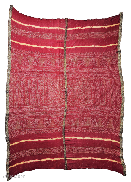  Ceremonial Badla Work (RealSilver) Tie and Dye Odhani known as Kumbhi,

Tie and Dye Work on the Gajji-Silk From Kutch Region of Gujarat, India.

c.1875-1900.

Its size is 120cmX165cm.

This were Traditionally used mainly by  ...