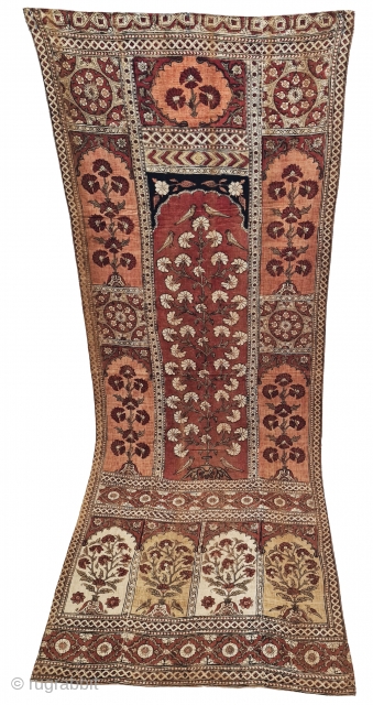 KalamkariTree of life from Lahore West (Pakistan) Punjab India. India. Kalamkari on the cotton with exotic birds and trees all within mihrab. Surrounded by a lozenge border .

Late 19th Early 20th Century.

  ...