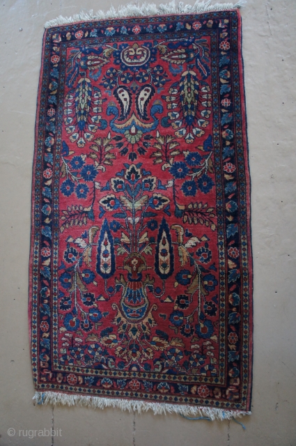 Ca. 1920 washed and painted red Sarouk with a more unusual design. Fine weave and very nice pile throughout, complete ends and edges. 27" x 47" No rot, weakness, odor or stains  ...