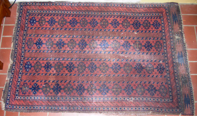 Antique tribal Baluch rug 3' x 4'6" with interesting and unusual pattern. Rug still has one of its original kilim endings. Rug has thin pile and some obvious signs of wear, but  ...