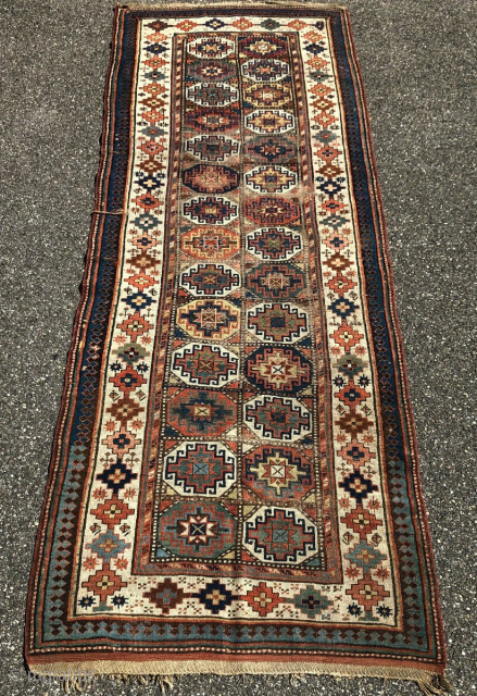 Antique Moghan Kazak 4' x 10'10" has surface wear but is structurally sound. For inquiries contact me directly at l_g_gerber@yahoo.com.