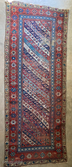 Antique Caucasian Gendje 3'5" x 8'10". Obvious wear and old repairs but still has excellent colors. Contact me directly at l_g_gerber@yahoo.com.  POR          