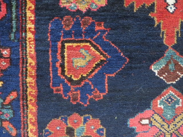 Perhaps a Feridan rug, in dozar size, made about 1930. OK condition with just some wear and nice colours.              