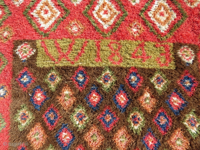 Finnish double sided ryijy rug, the front is in very good condition, signed and dated w1843, 175x135 cm. One end is folded, so the rug is not reduced. Not so easy to  ...