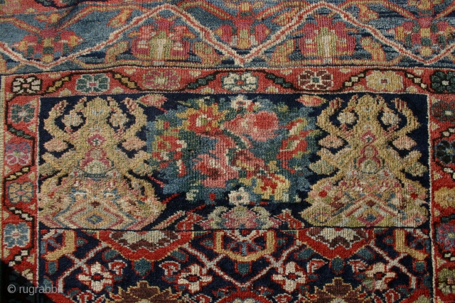 Probably antique and made somewere in NW Persia I guess, Kurdish I think and a lot of different colours, that´s for sure, some fading in the yellow, 310x140-154 cm.
Nice even wear, but  ...