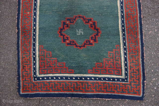 Tibetan sleeping rug, 19th c. 149x72 cm.
A good one, with beautiful patina and colours.
It has original kelim finishes and selvedges and one small repair in the medallion.
Can be even better if it  ...