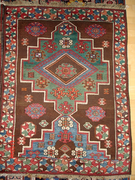 From Sonny Berntssons collection:
No 08 West Anatolia Aydin rug circa 1830.
105 x 132 cm
Some repairs in the brown field and the languetting on long sides are not original.
More info if you ask.
NOTE:  ...