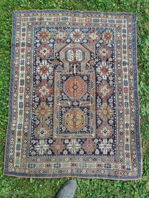 Antique and rare Armenian Kuba prayer rug (139 cm. x 104 cm.) Fine piece with good colors, and a special shield design. Low pile, with uneven wear, tiny holes here and there,  ...