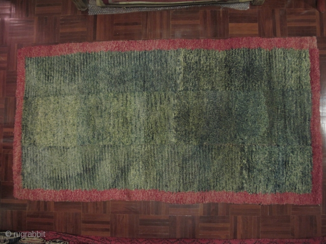 
Tibetan Tsukdruk, looped pile rug - a primitive form of ancient nomadic tibetan carpet weaving. 3 long strips sewn together vertically. Very nice hue of green in the centerfield, Excellent condition, Approx  ...